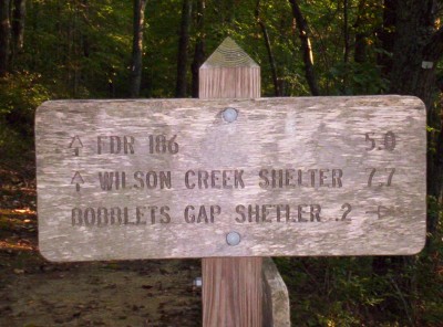 Bobblets Gap Shelter side trail sign, northern side (with "shelter" misspelled as "shetler")
