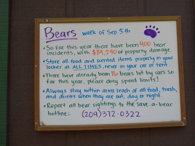 Notice board with bear information; one bullet reads, "So far this year there have been 400 bear incidents, with $89,290 of property damage."